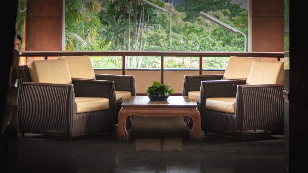 President Park seating area with rattan armchairs overlooking greenery